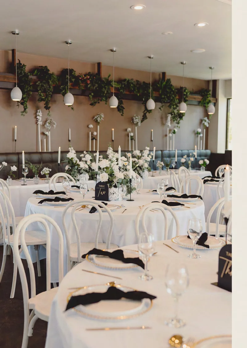 Wedding reception tables set with flowers at Santini's Restaurant & Bar
